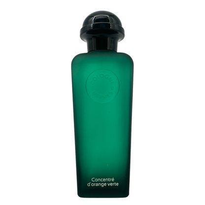 Hermes Concentre D'Orange Verte Eau De Toilette 100ml bottle, featuring a sleek green glass design with a black cap, representing a fresh citrus fragrance for men and women, available at Zakura Global.